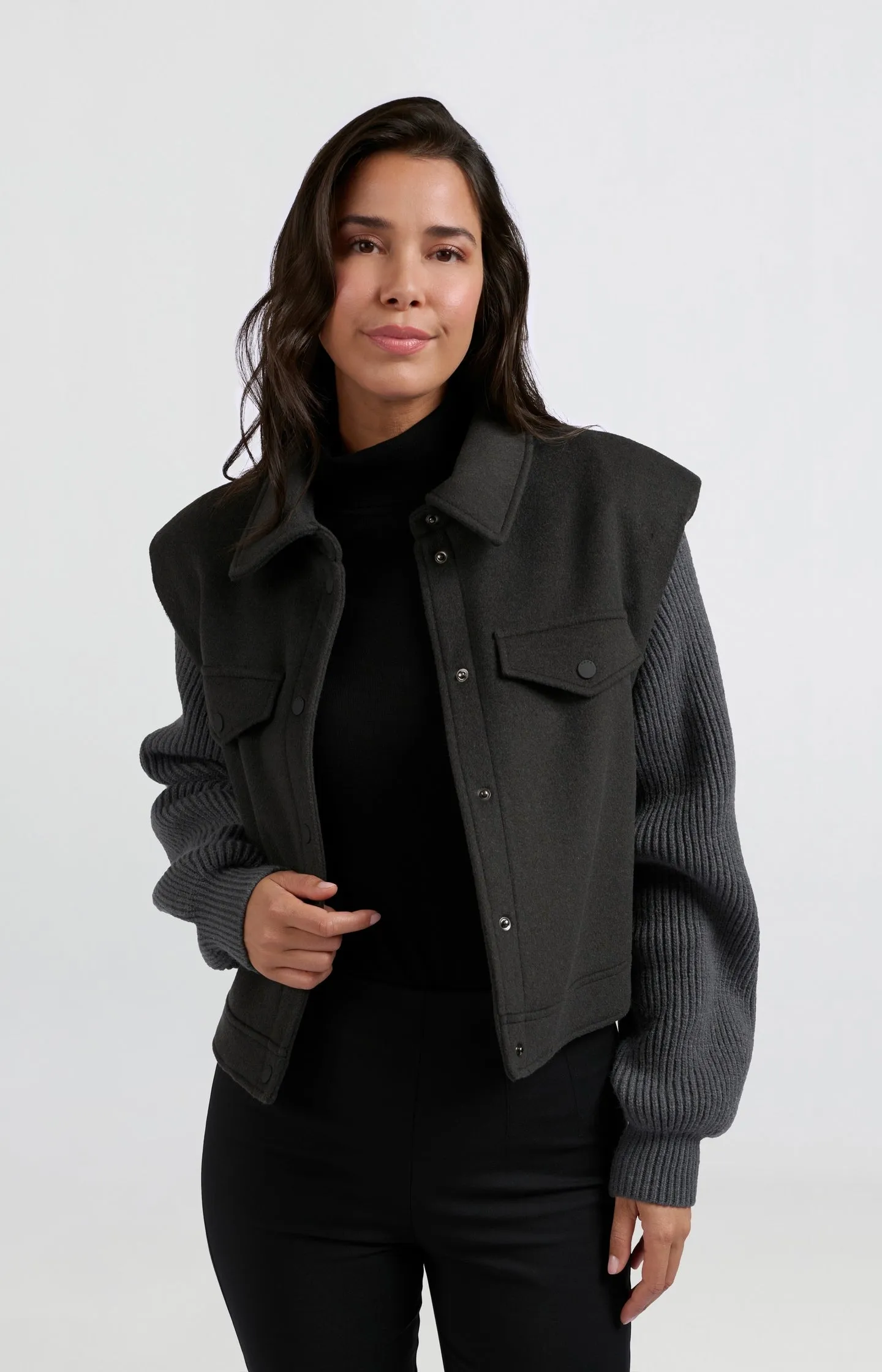 Dark gray coat with long sleeves, collar and button closure